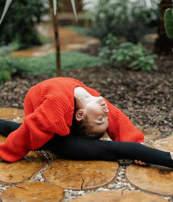 Athlete performing a focused yoga pose in a calm environment.